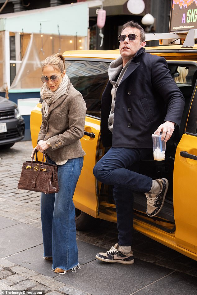 Ben, dressed in a cardigan and jeans, stayed close to Jennifer, who exuded movie star glamor in a simple ensemble that included a wool jacket and faded denim.