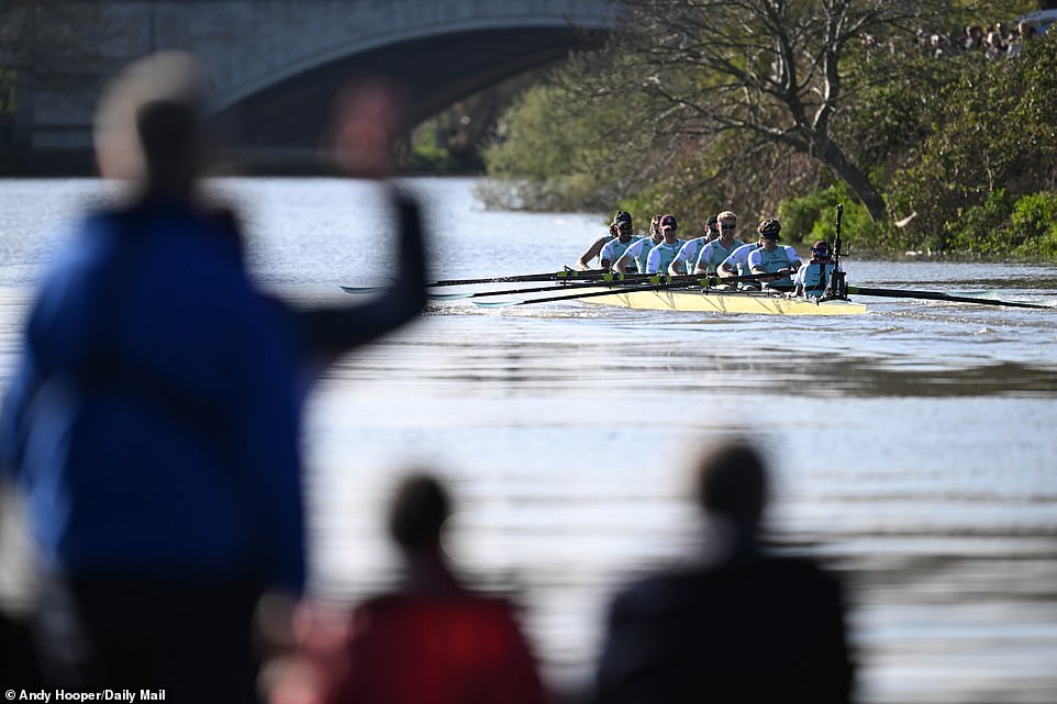 Cambridge took a three-and-a-half-length lead in the men's race and cruised to victory despite fears of a late collapse.