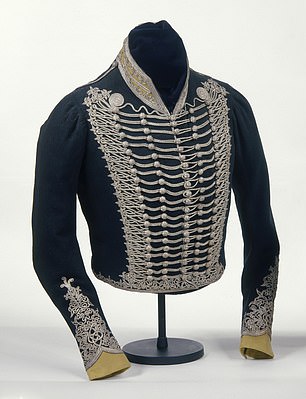 It appears alongside a deep blue uniform jacket designed by George himself.  The deep blue military jacket is lined in white silk and features silver lace on the chest, along with five rows of wooden buttons.