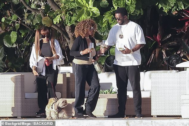 Meanwhile, the three-time Grammy winner - who has not been charged with any crime - spent Easter in Miami with two mystery women.