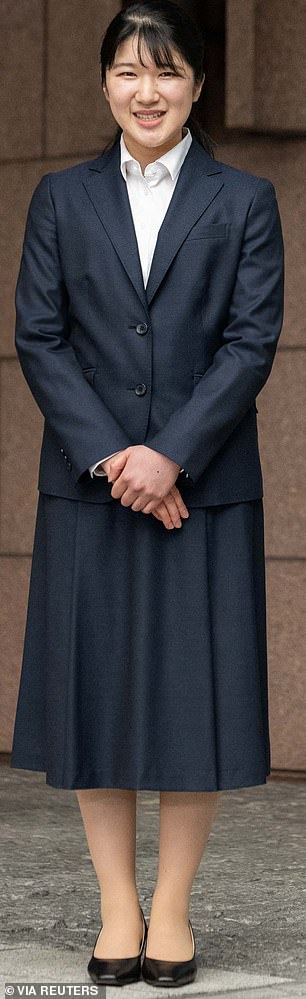 She chose to wear a chic navy skirt suit for her first day.