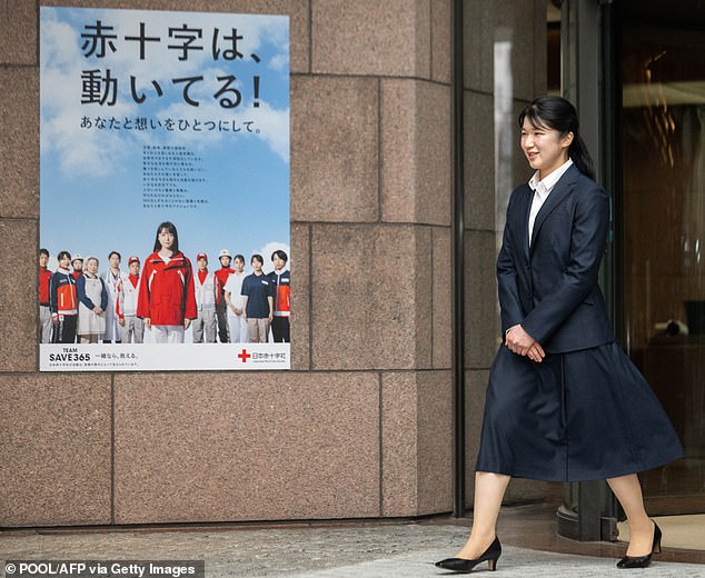 Aiko is shown walking out the door of the Japanese Red Cross as she begins work.