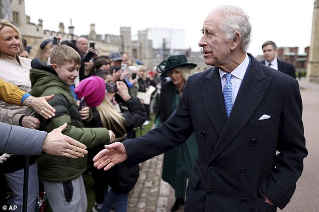 Charles was in good spirits as he shook hands with dozens of people at St. George's Chapel.