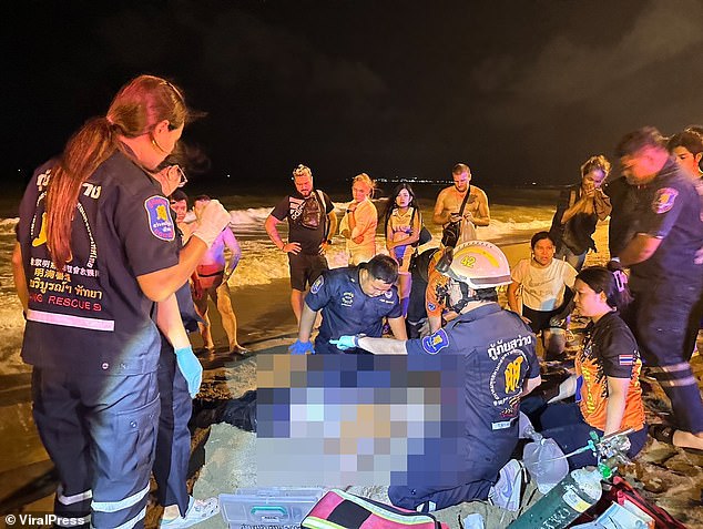In the photo, emergency services perform CPR.