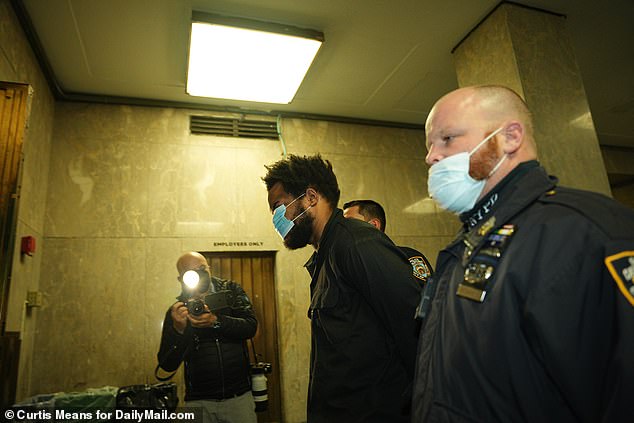Israel wore a coronavirus mask to conceal his identity when he appeared in court over the January attacks.