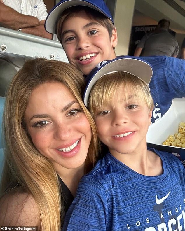 She also talked about watching the hit Barbie movie and told the publication that her kids didn't enjoy the movie (pictured with Milan, 11, and Sasha, nine).