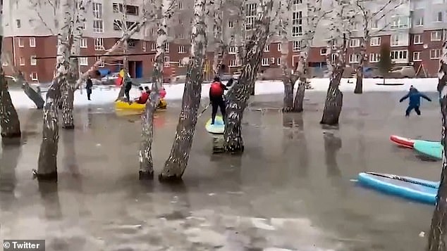 The flooded yard was located in front of an apartment building on Komarova Street.