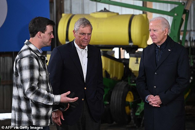 President Joe Biden, accompanied by U.S. Secretary of Agriculture Tom Vilsack, tours Dutch Creek Farms in Northfield, Minnesota, on November 1.