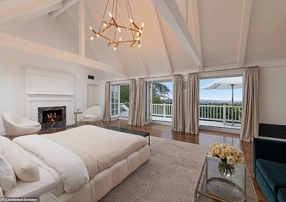 The bedroom has a fireplace and space for a sofa as it also offers views of Brentwood below.