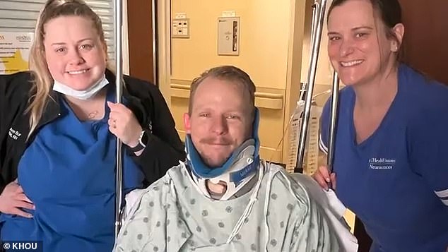 Jared Hill, pictured with his care team, was flown to Memorial Hermann Medical Center in Houston nearly a week after his surfing accident in Tulum.