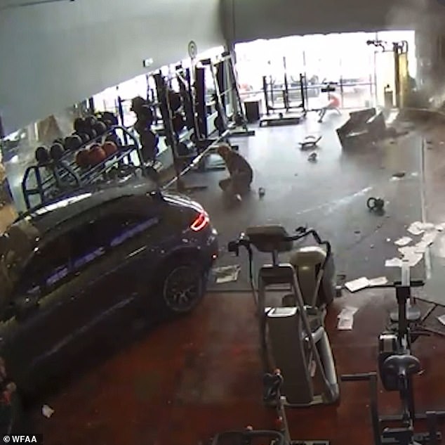 1712001348 235 Shocking moment SUV smashes through Dallas gym wall and hits