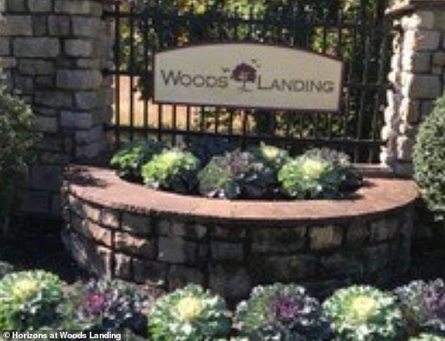 Eileen Bright, 75, was arrested and charged in connection with his death. She and Johnson lived together at the Woods Landing adult community home (pictured), but their relationship is unclear.