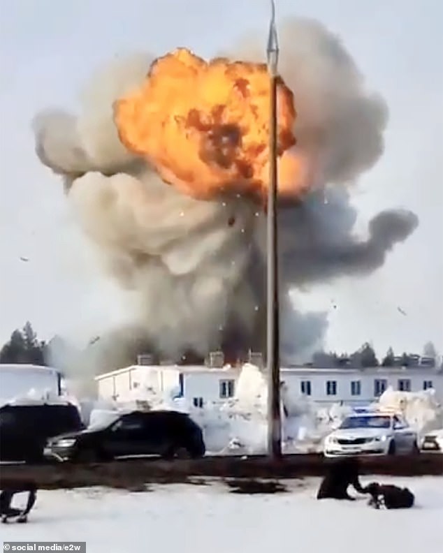 A huge cloud of smoke erupts as the building is destroyed, with reports of injuries.