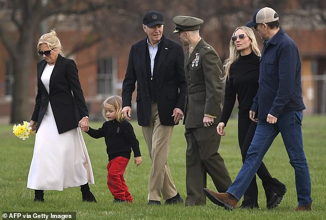 First lady Jill Biden (left) holds the hand of baby Beau Biden (second from left) as President Joe Biden (center left) and his family, including Hunter (right) and his wife Melissa Cohen (second from right) They arrive at Fort McNair.  after spending Easter Sunday at Camp David