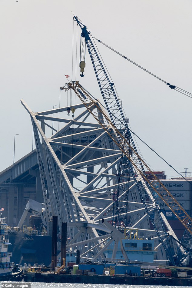 Debris is being removed from the collapsed Francis Scott Key Bridge as efforts begin to reopen the Port of Baltimore on Sunday.