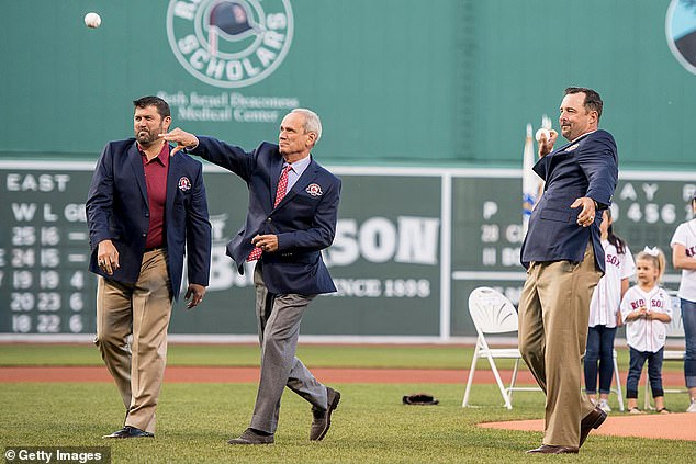 Lucchino (center) throws out the first pitch at a Red Sox Hall of Fame ceremony in 2016