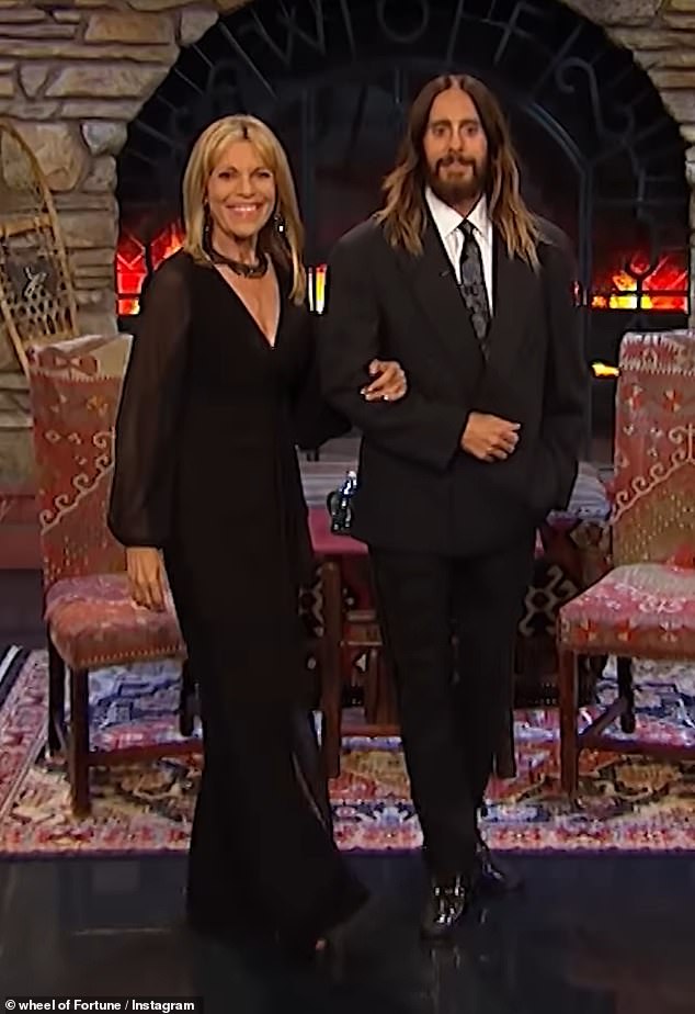 Leto wore an oversized black suit with a paisley tie while accompanying White, 67, who paired it with a sleek black jumpsuit.