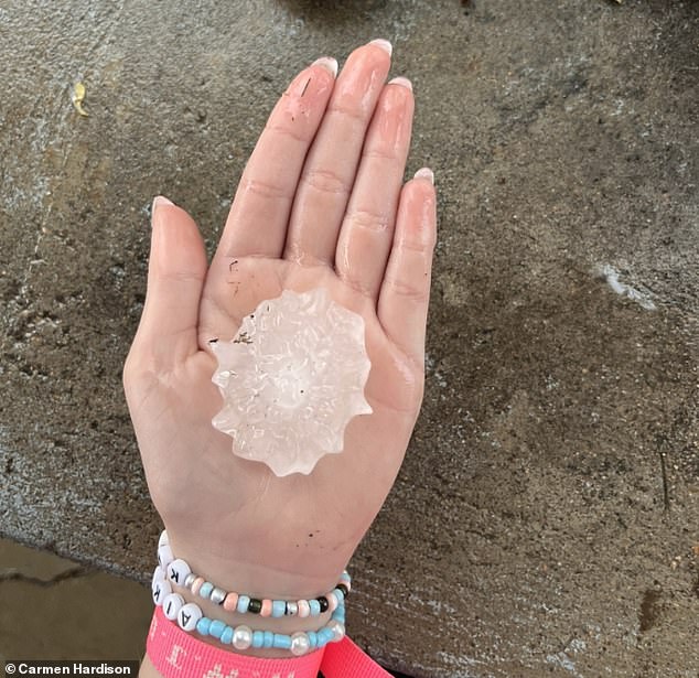 Other Kansas residents showed how enormous the hail pieces were when a large piece with pointy sides was seen in the palm of one hand.