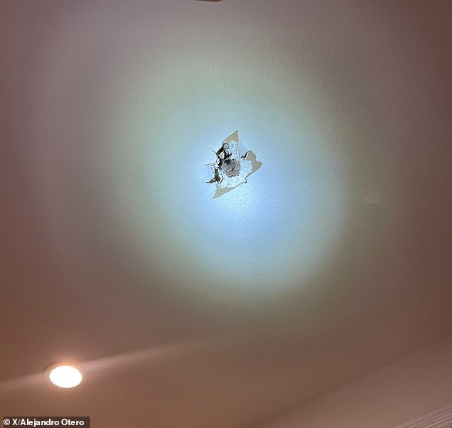 Alejandro Otero said the object almost hit his son when it fell through the roof (pictured).  Otero said his son called him while he was on vacation after hearing a 'tremendous sound'