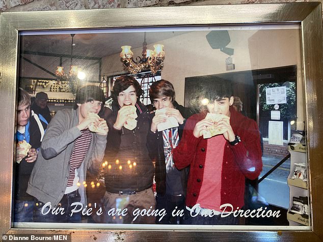 In the bakery photo is a photo of One Direction when they appeared at Mandevilles in their heyday.