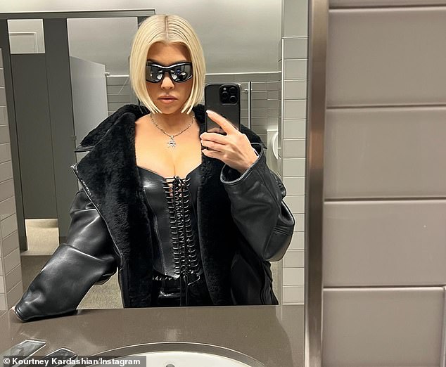 In another look, she rocked a leather corset, jacket and black sunglasses in a bathroom selfie.