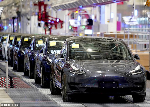 Slowdown: Tesla delivered 386,810 vehicles in the three months to the end of March. Shares fell by more than 5%, wiping £22 billion off the company's value