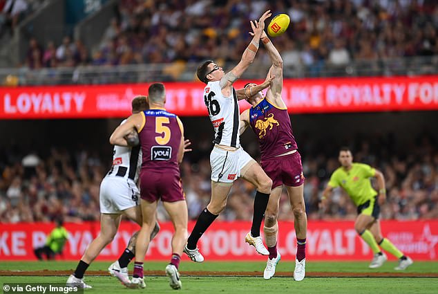 Collingwood then responded by beating Brisbane at the Gabba in a grand final replay last time out to record their first win of 2024 (pictured Pies ruckman Mason Cox in the middle)