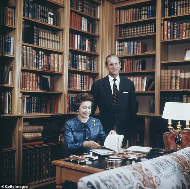 Queen Elizabeth and Prince Philip, Duke of Edinburgh, in the study at Balmoral Castle, Scotland, on September 26, 1976.