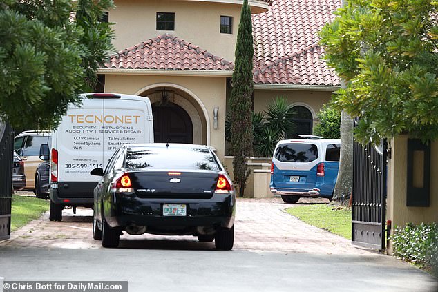 Cars were seen arriving at the property on Monday following his tragic death.