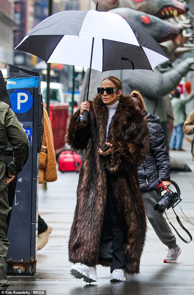 Jennifer, 54, looked glamorous in a brown fur coat as she braved the rainy New York weather.