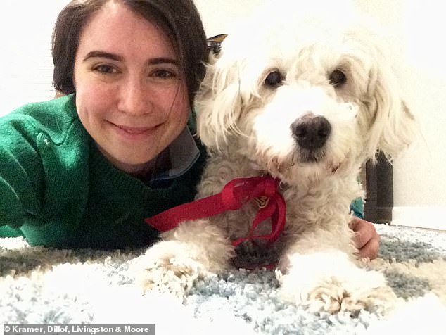 Meghan Brown, 36, suffered a traumatic brain injury while leaving 271 Madison Avenue on February 2, 2015. Pictured: Brown with her late service dog Dawson.