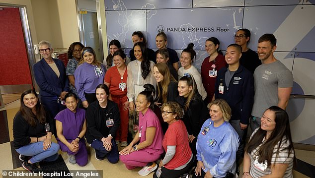 Meghan poses for a group photo during her visit to Children's Hospital Los Angeles last month.