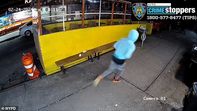 The suspect is still at large despite the NYPD releasing photos of his face and surveillance footage of him fleeing in a light blue padded jacket.
