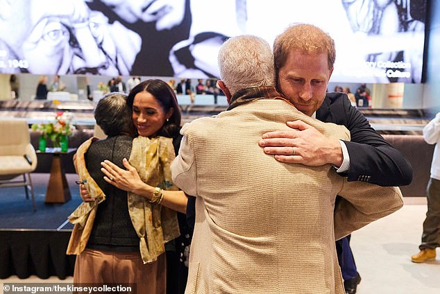 Hugs: The Duke and Duchess of Sussex were photographed hugging fellow hosts Bernard and Shirley Kinsley.