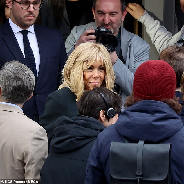 French first lady Macron, 70, was seen joining the cast and crew as she got stuck in ahead of her surprise appearance in an upcoming episode.