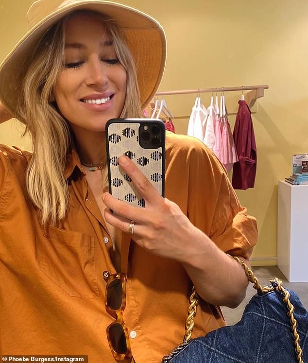 Phoebe Burgess poses for a mirror selfie with a phone case from The Daily Edited