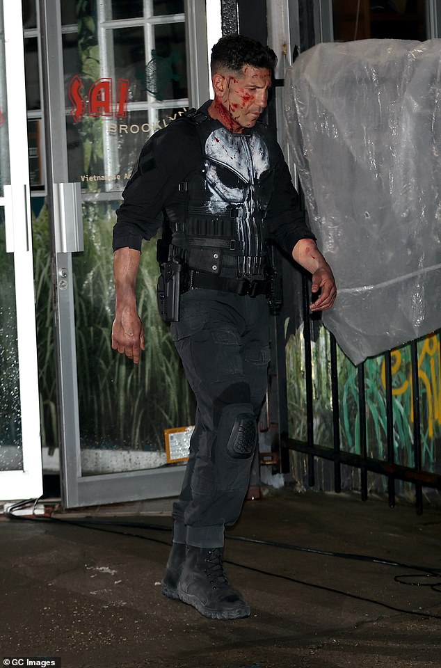 He wore his trademark skull-adorned armor, complete with black cargo pants and holstered pistols.