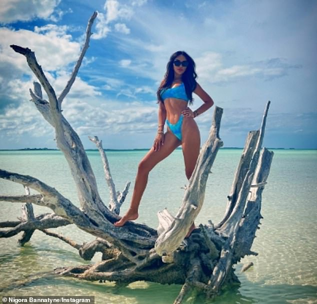 In fact, the brunette proved that age is just a number as she showed off her washboard abs in a speckled blue bikini while posing for a series of coastal photos.