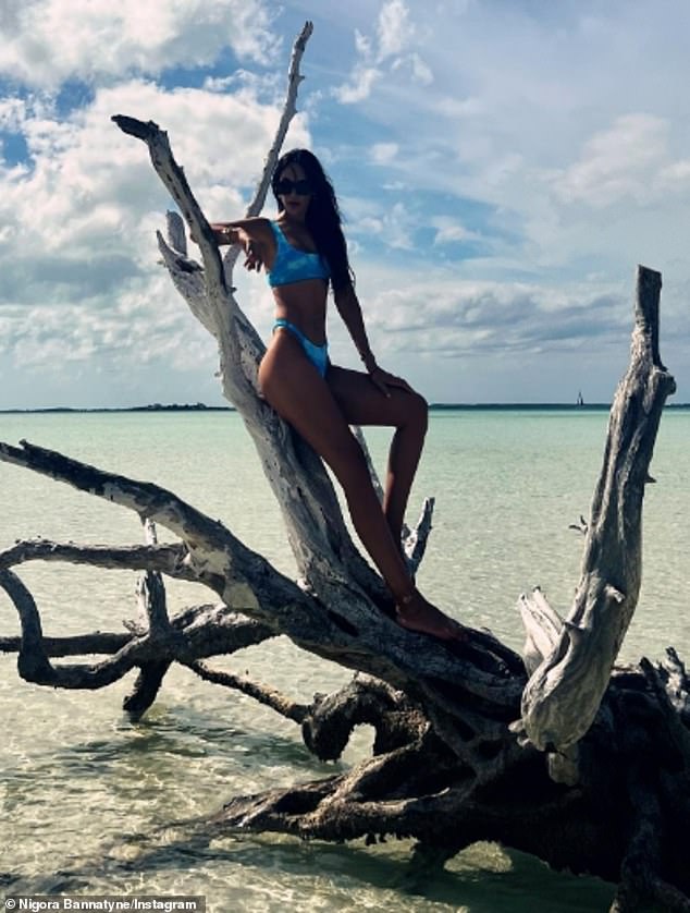 In one image, shared with her 29,000 Instagram followers, she leans against a tangled piece of sun-bleached driftwood.