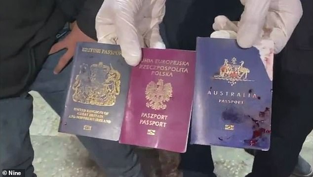 Photos of three bloody passports (pictured) were shared online shortly after the attack.