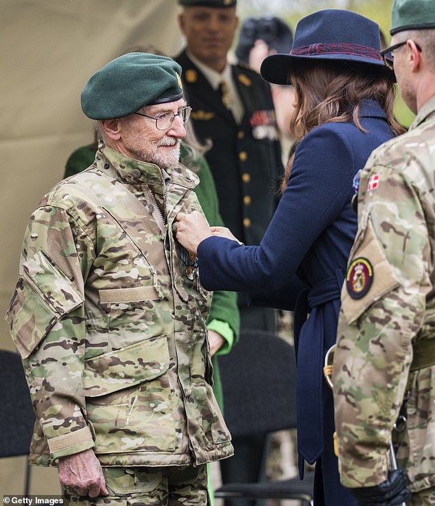Mary looked in good spirits as she gave a speech at the important event and presented the guardsmen with medals for their services in this role.