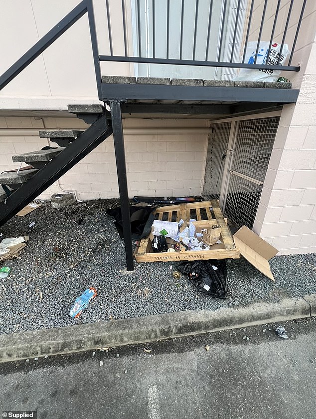 The squatters set up the makeshift house in a small space behind the business, forcing staff to clean up the mess left behind (pictured).