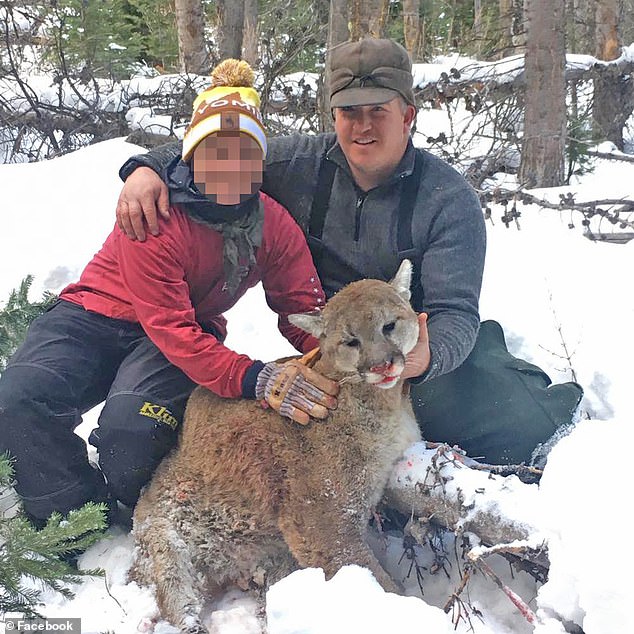 Cody Roberts, 42, of Daniel, Wyoming, was cited and fined for being in possession of a live wolf during an incident on February 29. Here he is depicted with a dead animal that he presumably hunted.