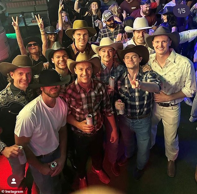 The group turned heads in cowboy hats at the Whiskey Row bar in Nashville, Tennessee.