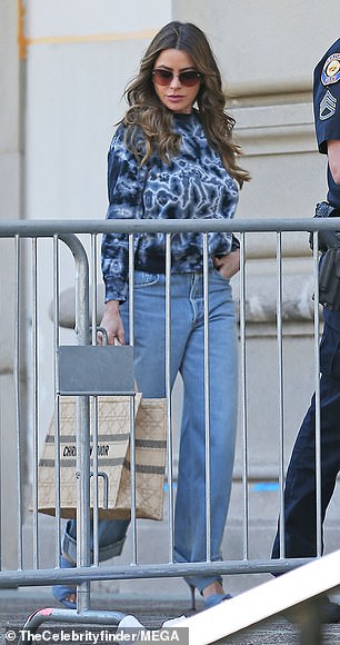 Heidi, 50, wore high-waisted cropped jeans and a green turtleneck with a jacket (L), while Sofia, 51, looked comfortable in bootcut jeans and a dark blue tie-dye shirt (R).