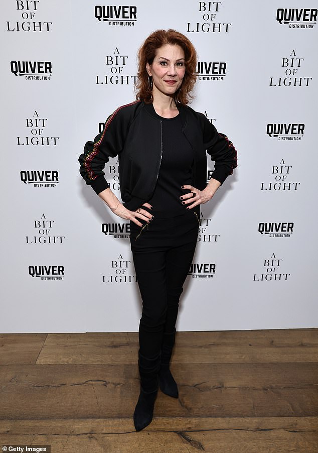 Stephanie Kurtzuba, a standout supporting actress in Martin Scorsese's modern classic The Wolf of Wall Street, looked relaxed in a casual black jacket with rainbow sequins on the sleeves.  She wore it with a casual black top and pants, as well as black suede boots.