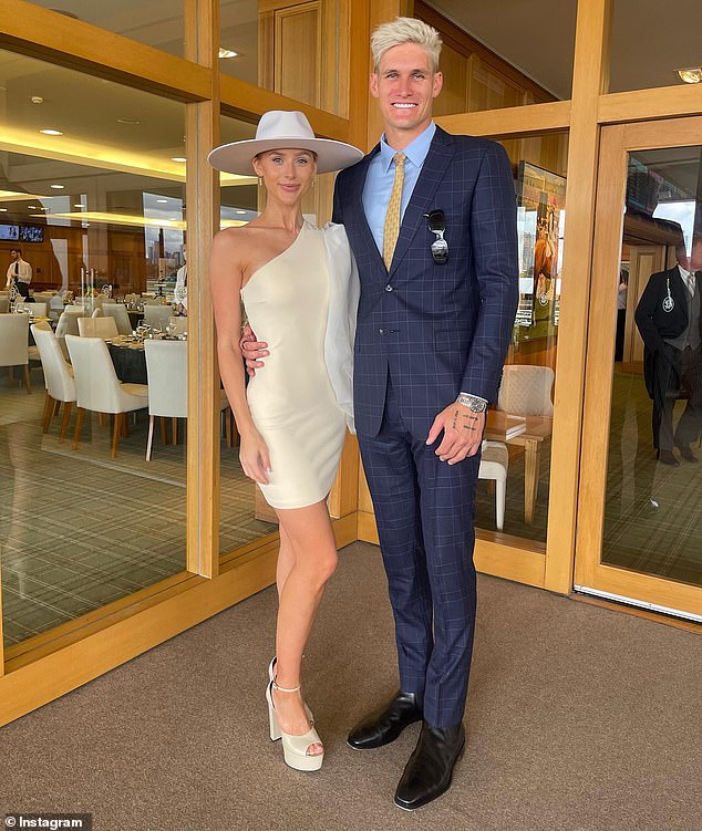 Rory Lobb (pictured with fiancee Lexi Mary at Flemington in Melbourne) was demoted to the VFL and criticized by football fans after starring in the embarrassing TikTok video.