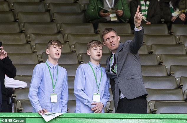 Fletcher, pictured with his sons in 2019 at the Old Firm Derby, had originally sent his sons to Man City's academy.