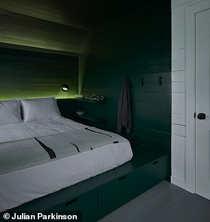 One bedroom has green accents.