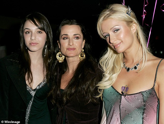 In the video, Farrah (seen with Paris and Kyle in 2005) can be seen posing alongside her mother as a teenager before the clip showed footage of the real estate agent as she was growing up.